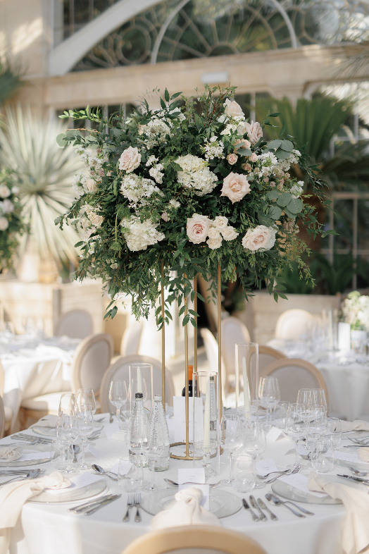 Tall table centrepiece of ivory hydrangeas and blush roses at Syon Park